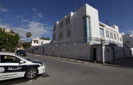 The car of a security company is seen parked in front of the Tunisian embassy in Tripoli April 17, 2014. REUTERS/Ismail Zitouny