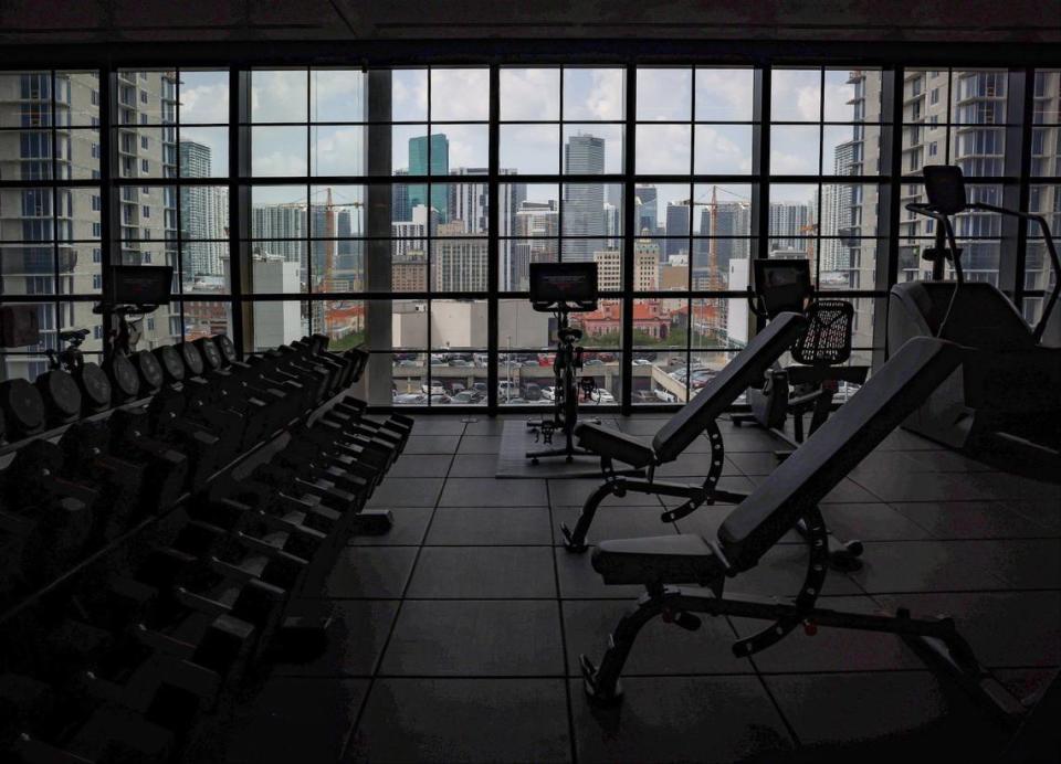 Guests and residents have a panoramic view of the downtown skyline as they workout in the large gym at the soon-to-open Gale Hotel and Residence during a recent property preview on Thursday, May 16, 2024 in Miami, Florida.