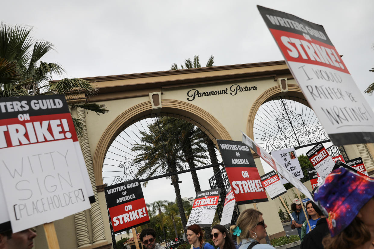 Los Angeles, CA - May 09: Seen through a titl-shift lens, supporters of the Writer's Guild of America strike, picket along Melrose Avenue, at Paramount Studios, in Los Angeles, CA, Tuesday, May 9, 2023(Jay L. Clendenin / Los Angeles Times via Getty Images)