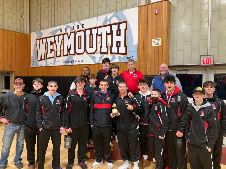 Members of the Whitman-Hanson High wrestling team pose after winning the Weymouth Tournament on Saturday, Jan. 15, 2022.