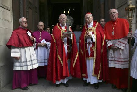 Archbishop of Westminster Cardinal Vincent Nicolls (3rd L) receives the Hungarian relic of St Thomas a Beckett from Archbishop of Esztergom-Budapest Cardinal Peter Erdo (3rd r) before a ceremony at Westminster Cathedral in London, Britain May 23, 2016. REUTERS/Neil Hall