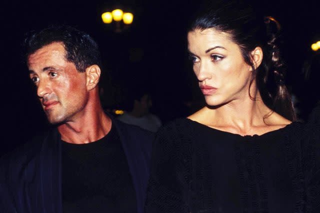 <p>William Stevens/Gamma-Rapho/Getty</p> Sylvester Stallone and Janice Dickinson in 1994.