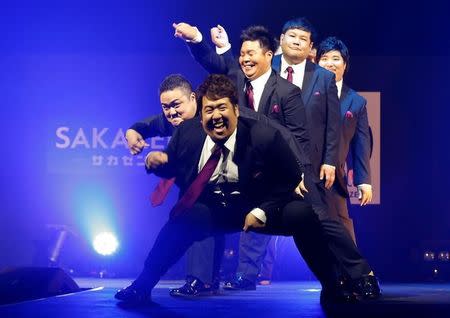 Models dance on the runway during Tokyo Pocchari collection, Japan's first fashion show for plump men in Tokyo. REUTERS/Kim Kyung-Hoon