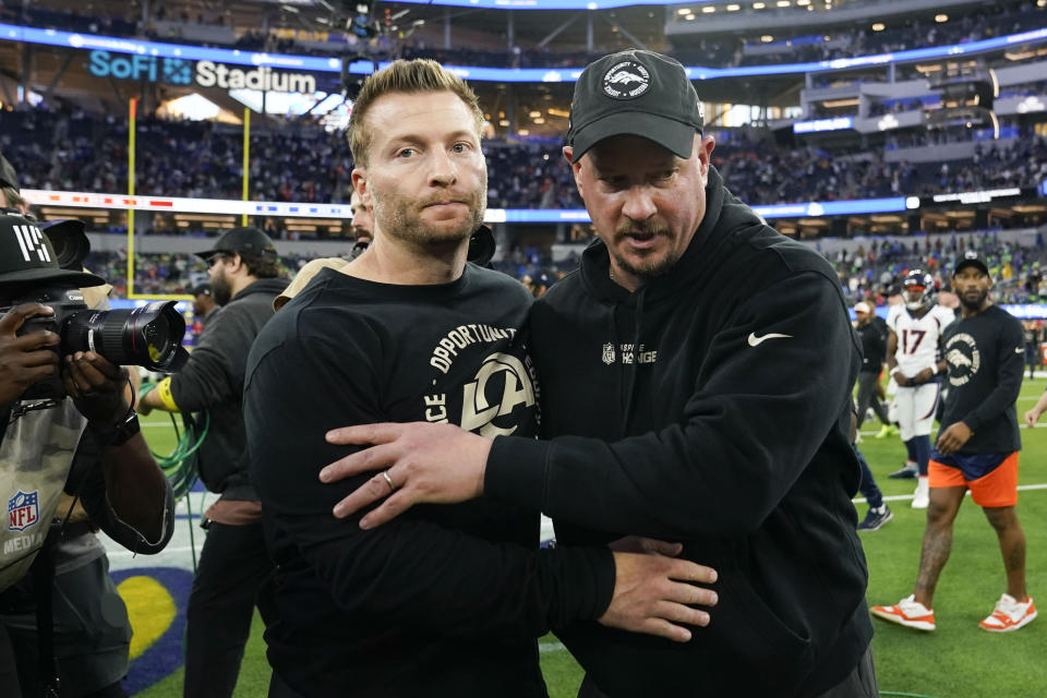 Los Angeles Rams head coach Sean McVay and Denver Broncos head coach Nathaniel Hackett leaves the field after an NFL football game between the Los Angeles Rams and the Denver Broncos on Sunday, Dec. 25, 2022, in Inglewood, Calif. (AP Photo/Marcio J. Sanchez)