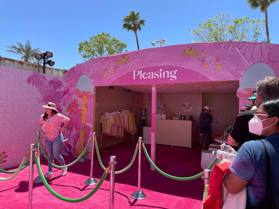 Coachellagoers wait in line to explore the Pleasing tent on Saturday, April 23, 2022.