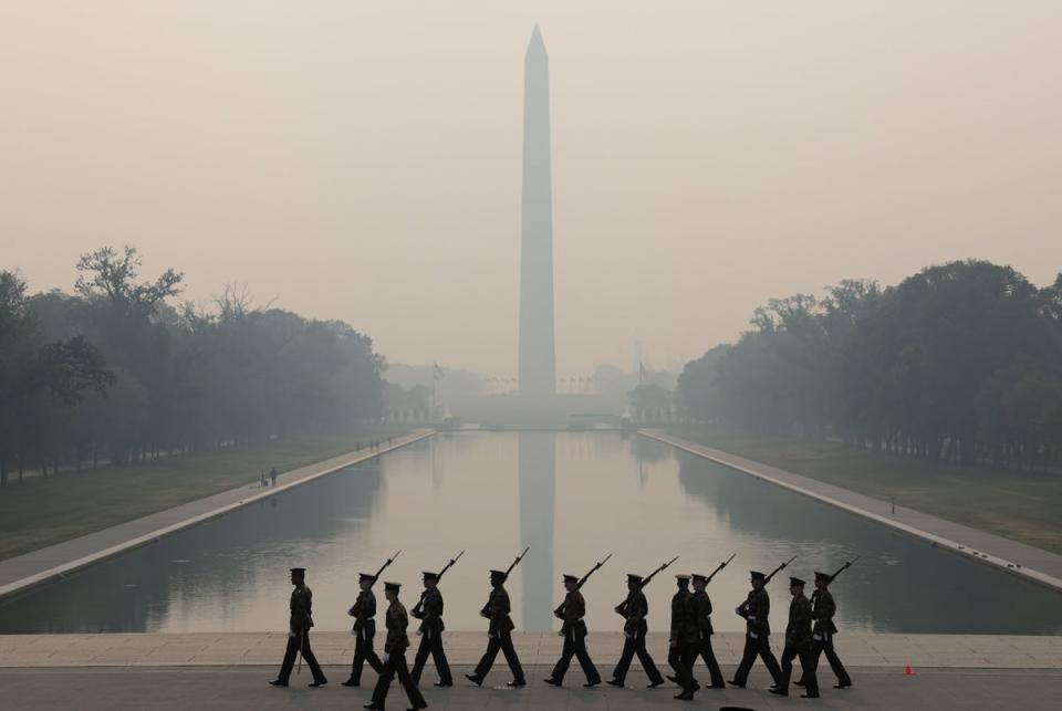 Members of the U.S. Marine Corps rehearse in hazy smoke for the Sunset Parade at the Lincoln Memorial on June 8, 2023 in Washington, DC (Getty Images)