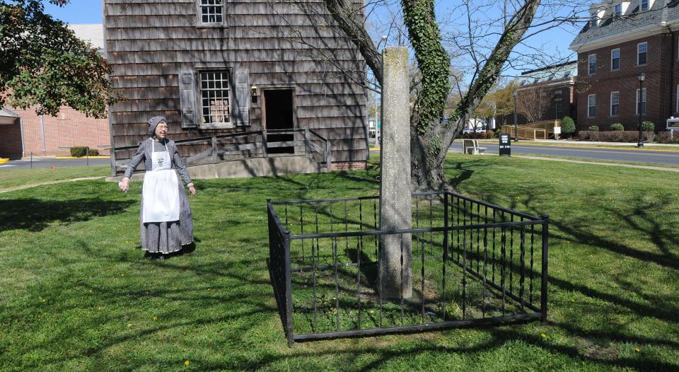 Pat Doleck, a volunteer at the historic Sussex County Courthouse, walks toward the whipping post in Georgetown in 2012. The whipping post will be removed Wednesday, July 1, 2020, and stored in a warehouse.