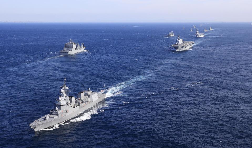 Japan's Maritime Self-Defense Force destroyer Shiranui, left, and other warshuips join an international fleet review in Sagami Bay, south of Tokyo, Sunday, Nov. 6, 2022. Eighteen warships participated from 12 countries, including the United States, Australia, Canada, India, New Zealand, Singapore and South Korea, while the United States and France also sent warplanes for the review. (Kyodo News via AP)