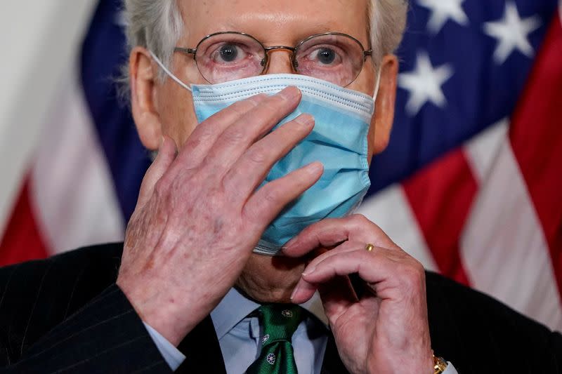 FILE PHOTO: Senate Majority Leader Mitch McConnell (R-KY) speaks to journalists in Washington