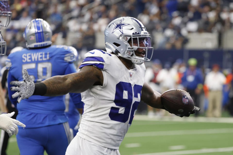 Dallas Cowboys defensive end Dorance Armstrong (92) reacts after recovering a fumble during the second half of an NFL football game against the Detroit Lions, Sunday, Oct. 23, 2022, in Arlington, Texas. (AP Photo/Ron Jenkins)