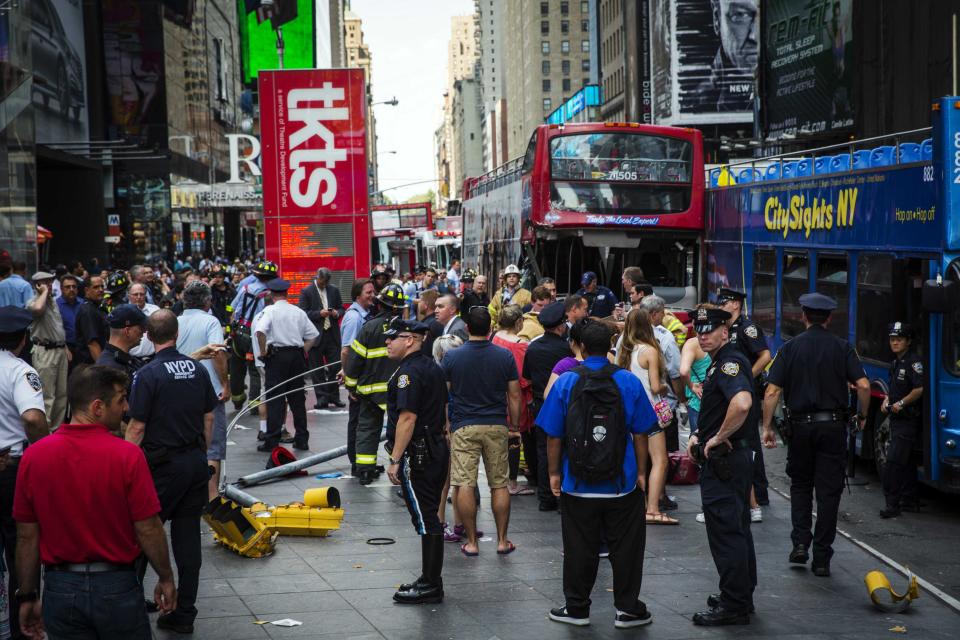 Double-decker tour buses collide in Times Square