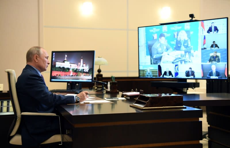 Russia's President Putin takes part in a video conference call outside Moscow