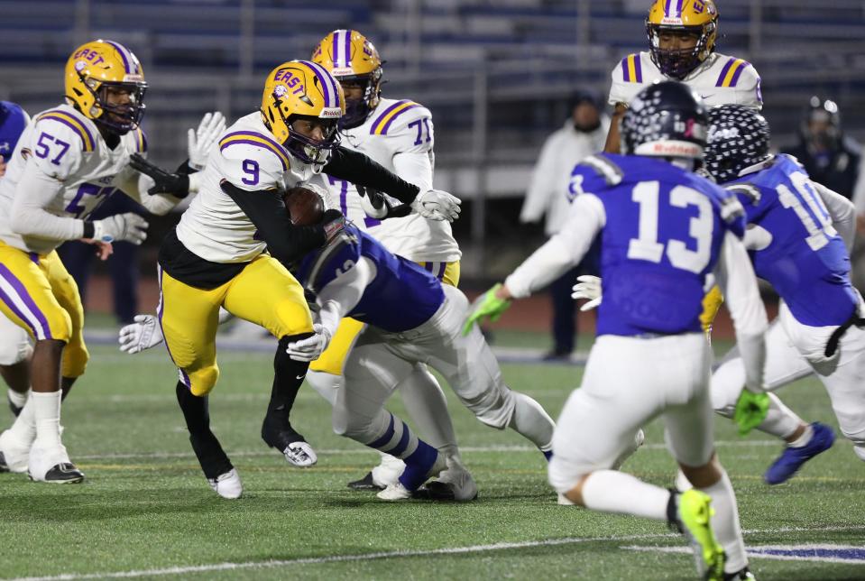 East/WOIS Ervin Wiggins Jr. is brought down by Whitesboro's Memphis Ferguson, who wraps up his legs. Bearing down on him are Whitesboro's Jax Hall and Carmen Centro.