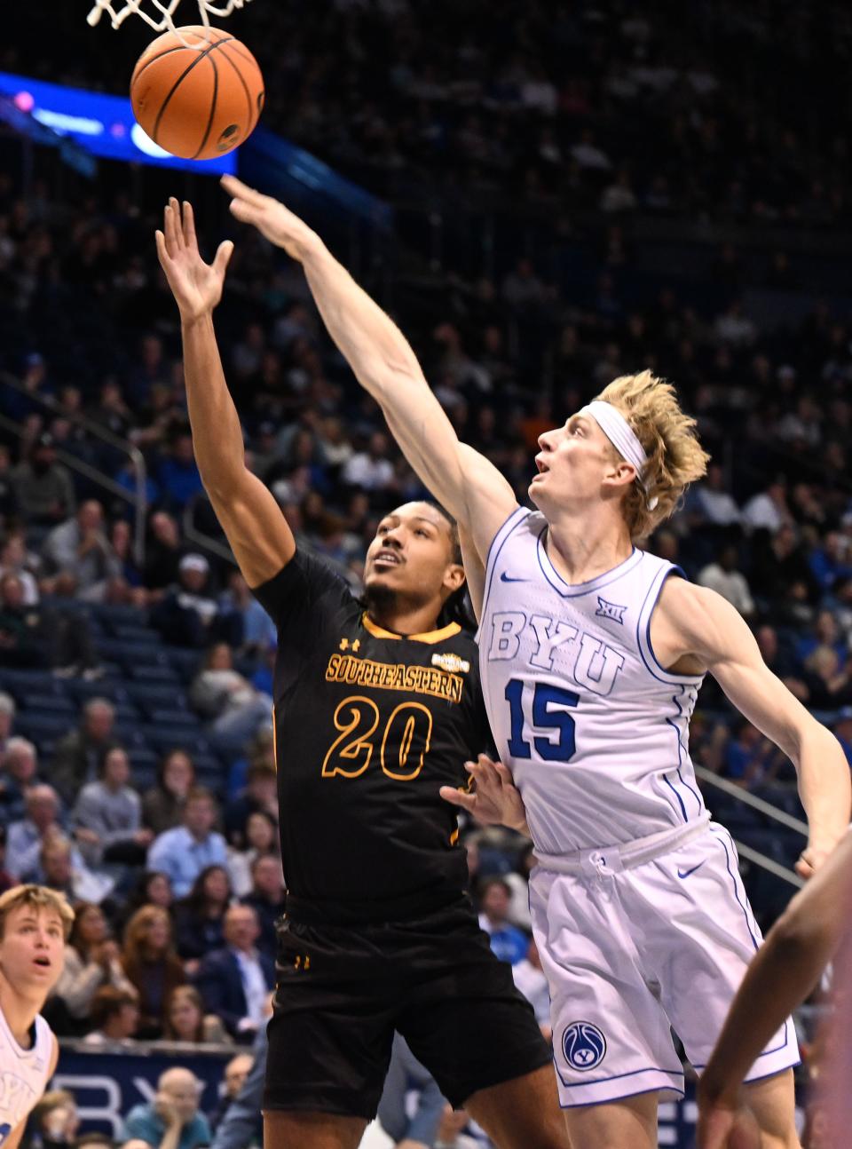 Brigham Young Cougars guard Richie Saunders (15) defends Southeastern Louisiana Lions guard Alec Woodard (20) as BYU and SE Louisiana play at the Marriott Center in Provo on Wednesday, Nov. 15, 2023. | Scott G Winterton, Deseret News