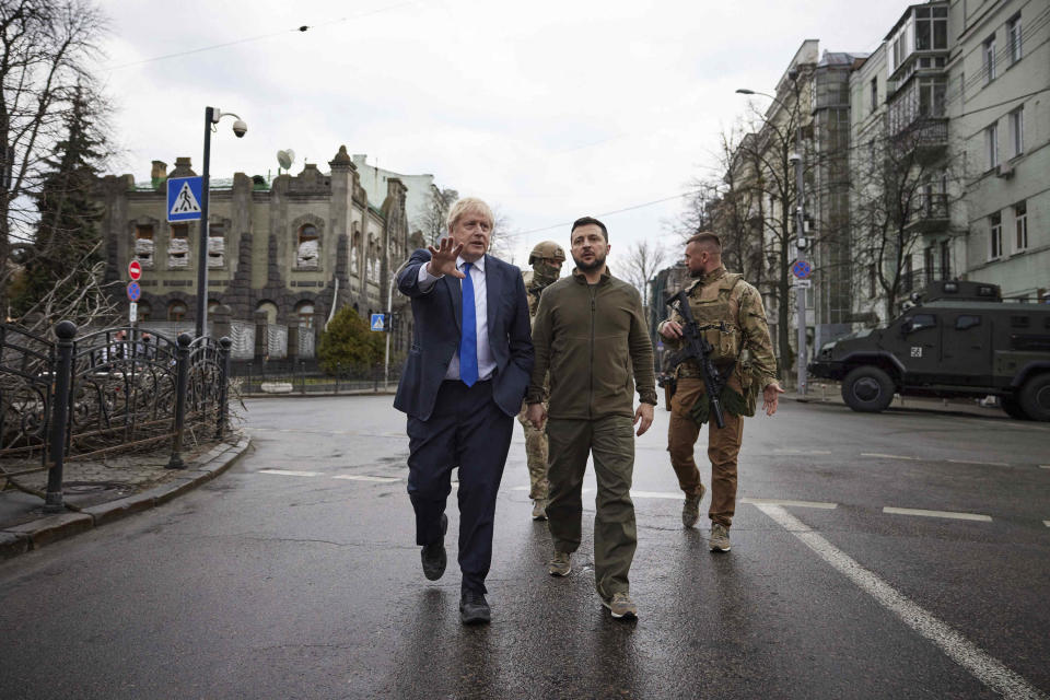 FILE - In this image provided by the Ukrainian Presidential Press Office, Ukrainian President Volodymyr Zelenskyy, center, and Britain's Prime Minister Boris Johnson, center left, walk during their meeting in downtown Kyiv, Ukraine, Saturday, April 9, 2022. When Johnson survived a no-confidence vote this week, at least one other world leader shared his relief. Ukrainian President Zelenskyy said it was “great news” that “we have not lost a very important ally.” (Ukrainian Presidential Press Office via AP, File)