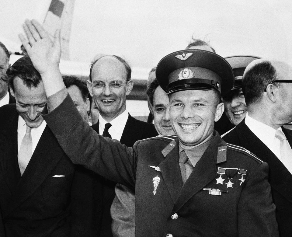 FILE - In this Tuesday, July 11, 1961 file photo, Soviet spaceman Yuri Gagarin waves after arriving at the London Airport, for a private visit as the guest of the Russian Trade fair. The successful one-orbit flight on April 12, 1961 made the 27-year-old Gagarin a national hero and cemented Soviet supremacy in space until the United States put a man on the moon more than eight years later. (AP Photo/File)