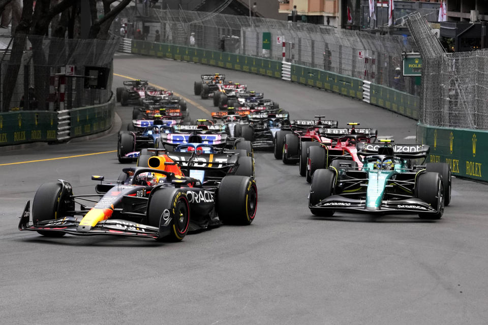 Red Bull driver Max Verstappen of the Netherlands, left, and Aston Martin driver Fernando Alonso of Spain, right, steer thier cars at the start of the Monaco Formula One Grand Prix, at the Monaco racetrack, in Monaco, Sunday, May 28, 2023. (AP Photo/Luca Bruno)