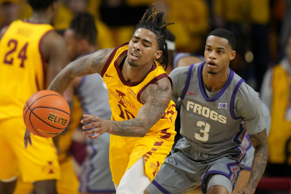 Iowa State guard Keshon Gilbert (10) runs down a loose ball in front of TCU guard Avery Anderson III (3) during the first half of an NCAA college basketball game, Saturday, Feb. 10, 2024, in Ames, Iowa. (AP Photo/Charlie Neibergall)