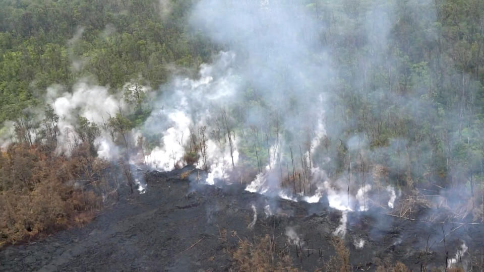 Molten rock flows and burst to the surface, threatening homes in a rural area in this still image from an aerial video taken from a Hawaii Army National Guard a week after the eruption of the Kilauea volcano, in Pahoa, Hawaii, U.S., May 10, 2018.