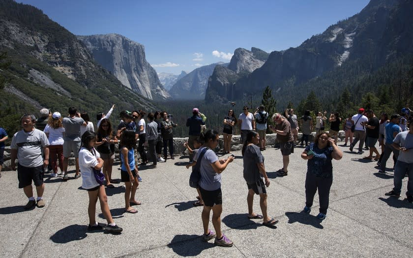 YOSEMITE NATIONAL PARK- JULY 14, 2017-- Visitor crow Tunnel View overlooking Yosemite Valley in Yosemite National Park July 14, 2017. (Brian vander Brug/Los Angeles Times)