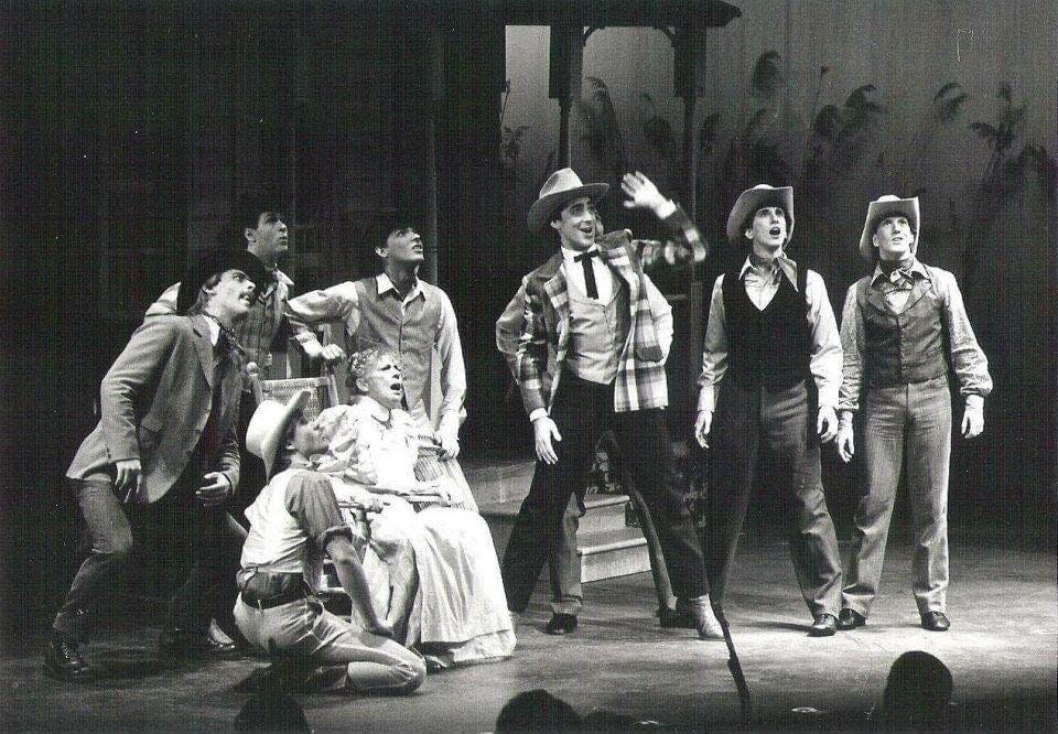 Rick Kerby, second from right, was a young performer when he appeared in a production of “Oklahoma!” in about 1982. He is directing and choreographing a new production for the Manatee Players.