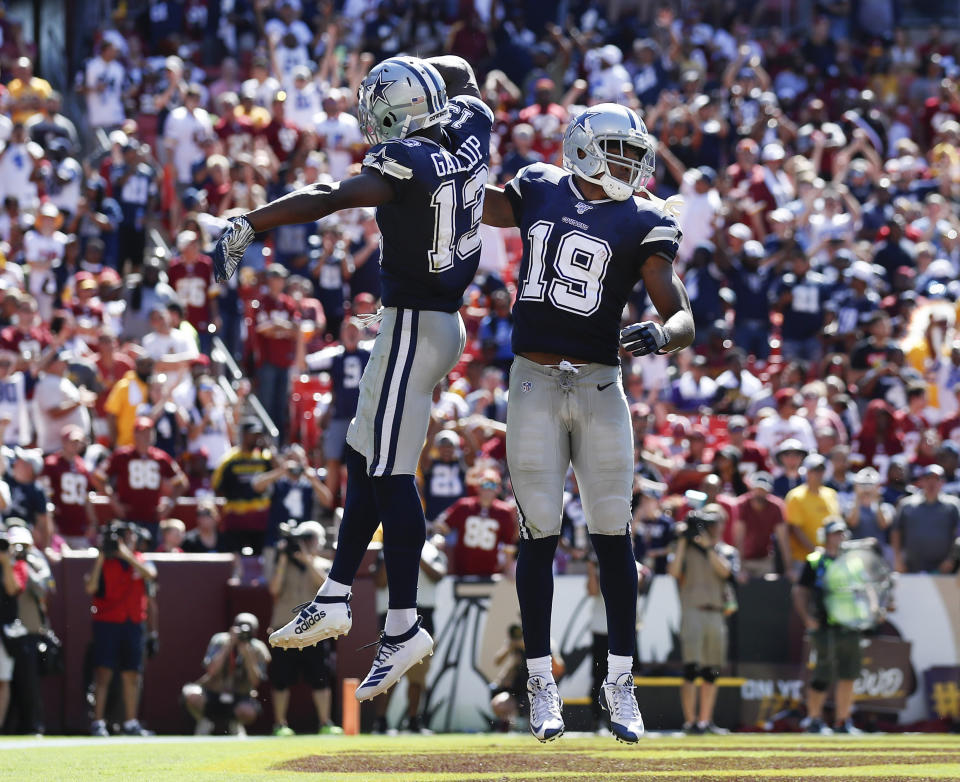 Dallas Cowboys wide receiver Amari Cooper (19) celebrates his touchdown with teammate wide receiver Michael Gallup (13) in the second half of an NFL football game, Sunday, Sept. 15, 2019, in Landover, Md. (AP Photo/Alex Brandon)