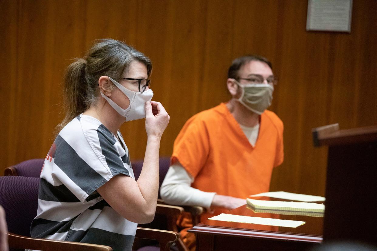 Jennifer Crumbley and James Crumbley, parents of the alleged Oxford High School shooter who is charged with killing four people and wounding seven others, in court for their pretrial hearing on March 22, 2022.