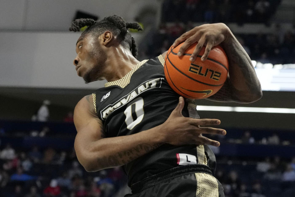 Bryant University guard Earl Timberlake pulls down a rebound during the first half of an NCAA college basketball game against Mississippi, Sunday, Dec. 31, 2023, in Oxford, Miss. (AP Photo/Rogelio V. Solis)