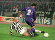 FILE - Juventus' Gianluca Vialli, left, and Real Madrid's Miguel Parlan Chendo challenge for the ball during their second-leg, quarterfinal match of the Champions League, at Turin's Delle Alpi stadium, Italy, Wednesday, March 20, 1996. Gianluca Vialli, the former Italy striker who helped both Sampdoria and Juventus win Serie A and European trophies before becoming a player-manager at Chelsea, has died on Friday, Jan. 6, 2023. He was 58. (AP Photo/Luca Bruno, file)