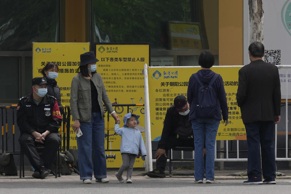 Residents leave after being turned away from Chaoyang park which was closed due to pandemic measures on Monday, May 9, 2022, in Beijing. (AP Photo/Ng Han Guan)