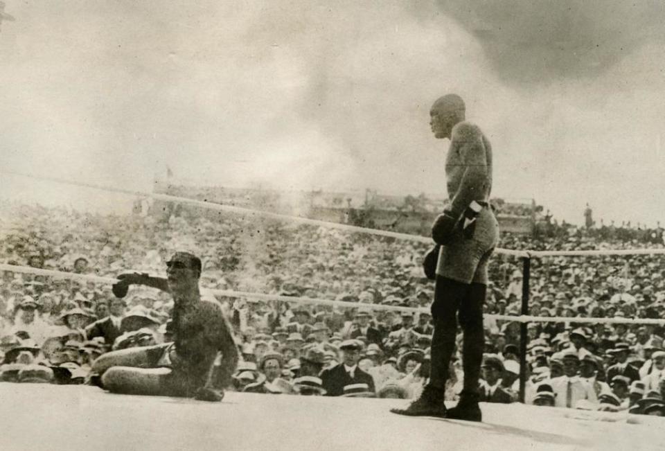 Jack Johnson, right, knocks out Jim Jeffries in Reno, Nevada, 4 July 1910.