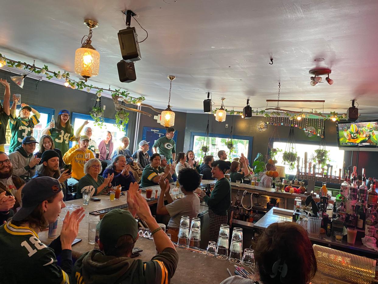 Packers fans cheer at the Cactus Club during a game in the 2022 season.