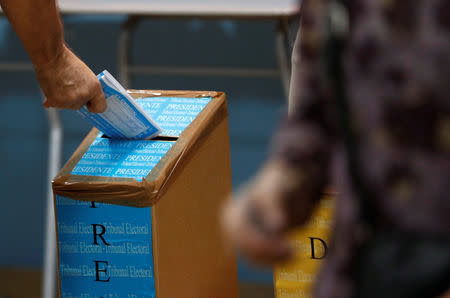 A man casts his ballot during the general election in Panama City, Panama May 5, 2019. REUTERS/Carlos Jasso