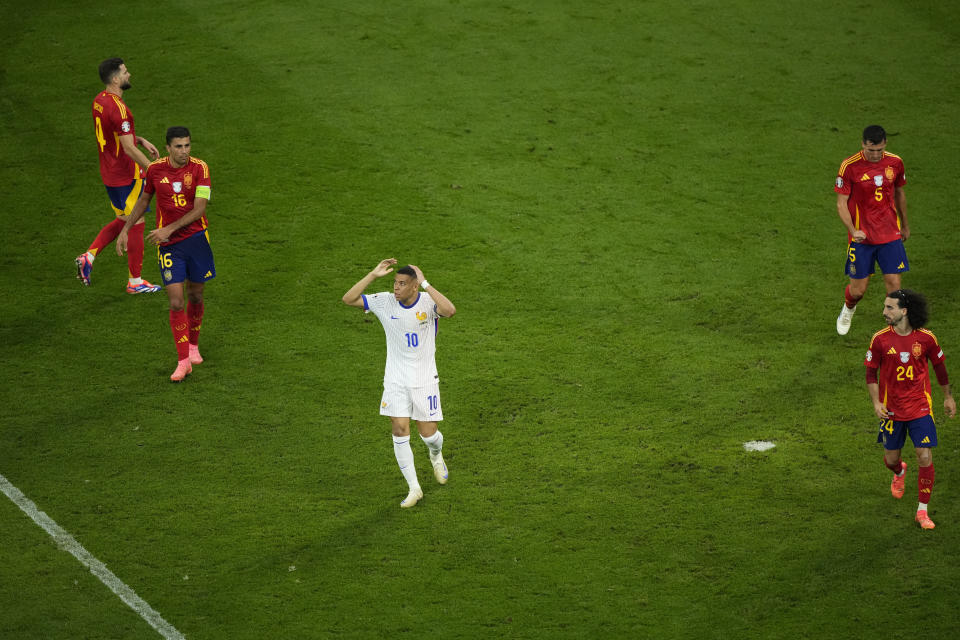 Kylian Mbappe of France reacts after missing a chance to score during a semifinal match between Spain and France at the Euro 2024 soccer tournament in Munich, Germany, Tuesday, July 9, 2024. (AP Photo/Ebrahim Noroozi)