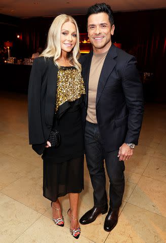 <p>Randy Shropshire/Getty</p> Kelly Ripa (L) and Mark Consuelos (R)