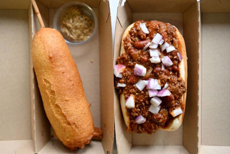 A corn dog with honey mustard and a Rosie’s Big Dog with chili and onions from Rosie’s Hotdogs and Handpies. The corn dog is made with A Rosie’s Big Dog coated in a home made cornmeal batter and flash fried.