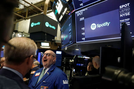 A price update is given on shares of Spotify before the company's direct listing on the floor of the New York Stock Exchange in New York, U.S., April 3, 2018. REUTERS/Lucas Jackson