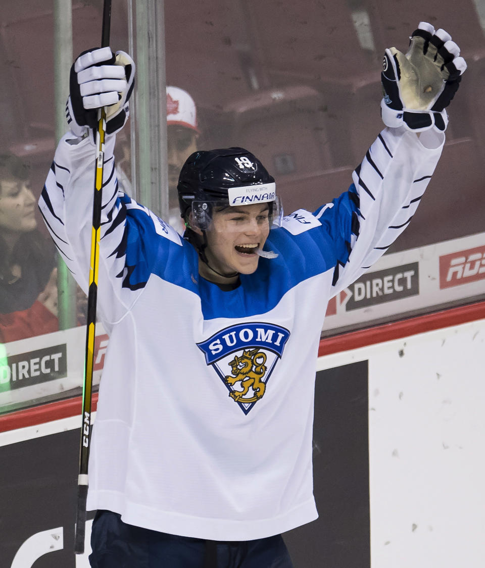 Finland's Rasmus Kupari celebrates his team'ss win over Switzerland in a world junior hockey championships semifinal in Vancouver, British Columbia, Friday, Jan. 4, 2019. (Jonathan Hayward/The Canadian Press via AP)