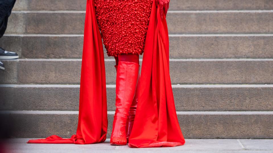 paris, france january 23 doja cat wears red off shoulder dress, red boots outside schiaparelli during paris fashion week haute couture spring summer day one on january 23, 2023 in paris, france photo by christian vieriggetty images
