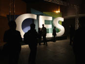 LAS VEGAS, NV - JANUARY 11: Attendees pose by the CES sign outside the 2012 International Consumer Electronics Show at the Las Vegas Convention Center January 11, 2012 in Las Vegas, Nevada. CES, the world's largest annual consumer technology trade show, runs through January 13 and features more than 3,100 exhibitors showing off their latest products and services to about 140,000 attendees. (Photo by Bruce Bennett/Getty Images)