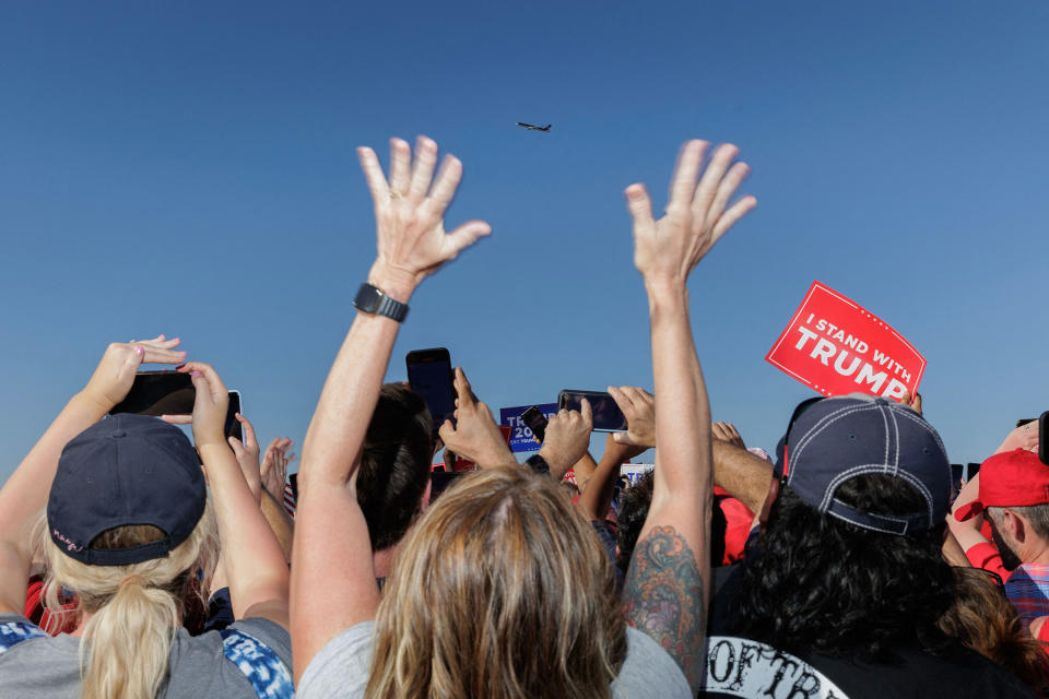 Supporters of former President Donald Trump cheer as his plane flies over the 2024 election campaign rally in Waco, Texas, on March 25, 2023.<span class="copyright">Shelby Tauber—AFP/Getty Images</span>