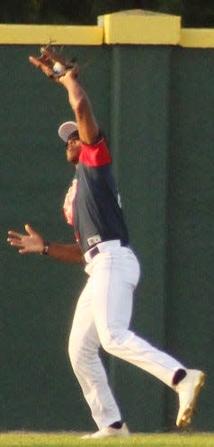 Evan McClendon goes back to the wall to snare a line drive during Bartlesville Doenges Ford Indians action last weekend.
