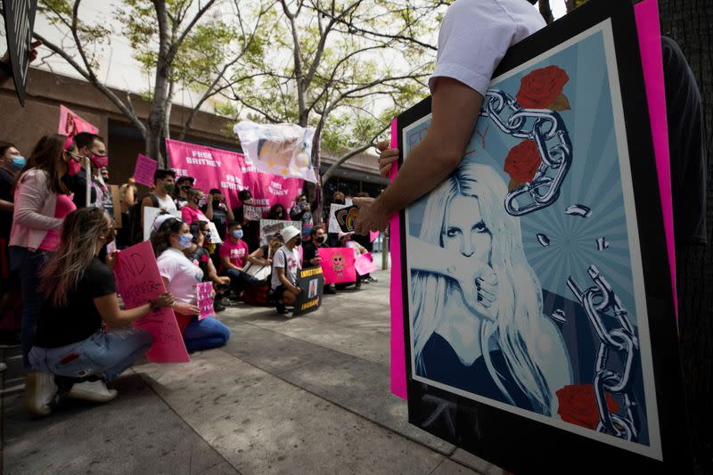 A supporter holds a poster during a rally for pop star Britney Spears during a conservatorship case hearing at Stanley Mosk Courthouse in Los Angeles