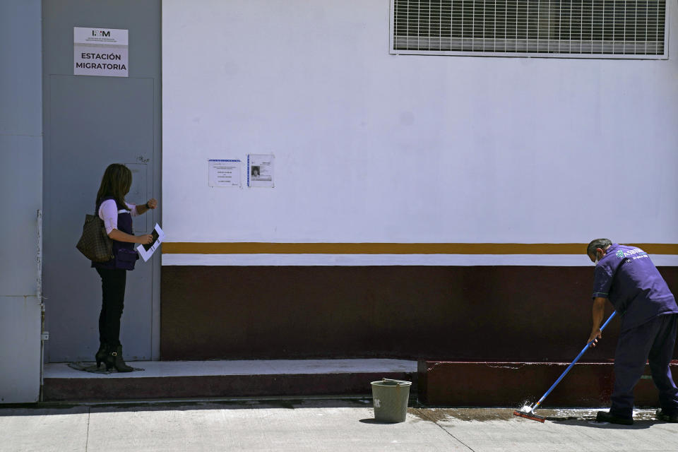 Public Defender Monica Vazquez waits outside an immigration office to visit detained migrants in Puebla, Mexico, Friday, Sept. 23, 2022. The Federal Institute of Public Defenders has alleged in complaints that immigration officials are working in collusion with a private law firm at the expense of migrants’ rights. The institute says that in response, some of its employees, such as Vazquez, have been harassed and intimidated. (AP Photo/Marco Ugarte)