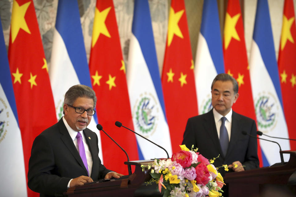 El Salvador's Foreign Minister Carlos Castaneda, left, speaks as China's Foreign Minister Wang Yi listens at a signing ceremony to mark the establishment of diplomatic relations between El Salvador and China at the Diaoyutai State Guesthouse in Beijing, China, Tuesday, Aug. 21, 2018. Taiwan says it is breaking off diplomatic ties with El Salvador because the Central American country plans to defect to rival Beijing. The move is the latest blow to the self-ruled island that China has been trying to isolate on the global stage. (AP Photo/Mark Schiefelbein)