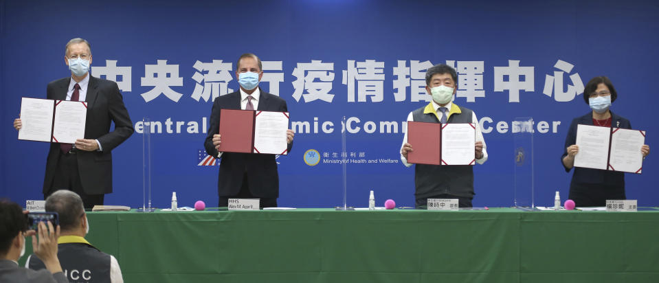 From left; Director of the American Institute in Taiwan (AIT) William Brent Christensen, U.S. Health and Human Services Secretary Alex Azar, Taiwanese Minister of Health and Welfare Chen Shih-chung and Director-General of Bureau of Foreign Trade Yang Jen-ni pose for a photo during a signing ceremony for a memorandum of understanding at the Central Epidemic Command Center in Taipei, Taiwan, Monday, Aug. 10, 2020. Azar arrived in Taiwan on Sunday in the highest-level visit by an American Cabinet official since the break in formal diplomatic relations between Washington and Taipei in 1979. (AP Photo/Chiang Ying-ying)