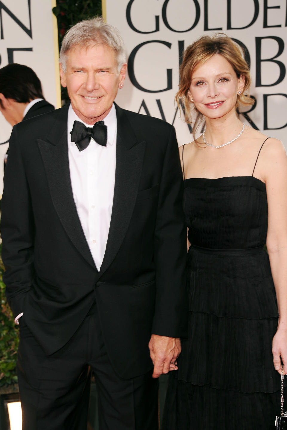 BEVERLY HILLS, CA - JANUARY 15: Actors Harrison Ford (L) and Calista Flockhart arrive at the 69th Annual Golden Globe Awards held at the Beverly Hilton Hotel on January 15, 2012 in Beverly Hills, California. (Photo by Jason Merritt/Getty Images)