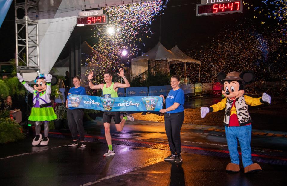 Nolan McKenna of the Chicago area is crowned the overall winner of the Disney Pixar Toy Story 10-Miler during runDisney Springtime Surprise Weekend on April 16, 2023, in Lake Buena Vista, Fla. The runner crossed the finish line with a time of 54:49 to close out the final on-site race weekend of the 2022-23 runDisney race season. (Kent Phillips, photographer)