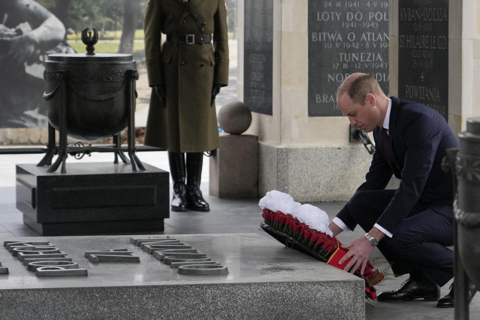 Britain's Prince William lays a wreath of flowers at the Tomb of the Unknown Soldier in Warsaw, Poland, Thursday, March 23, 2023. (AP Photo/Czarek Sokolowski)