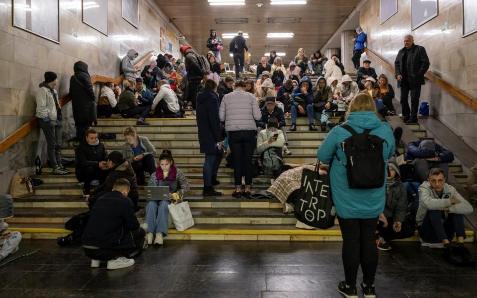 Ukrainians shelter inside a subway station during a Russian missile attack in Kyiv - VIACHESLAV RATYNSKYI/REUTERS